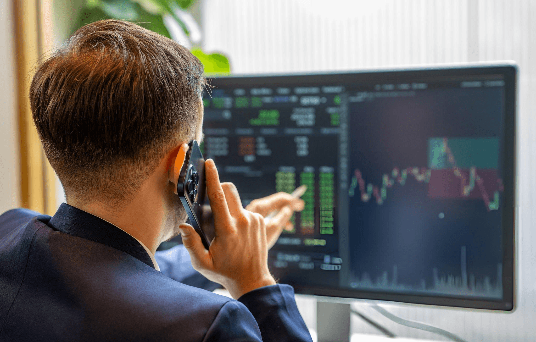 Portfolio manager reviewing market data on a trading desk